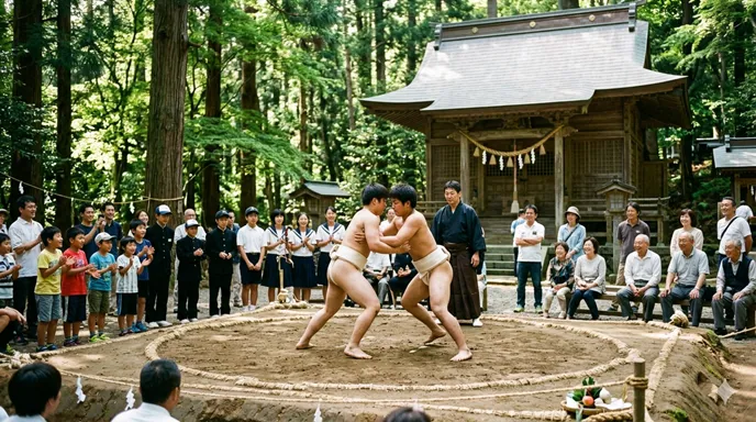 神社の境内に設けられた土俵で、地域の人々が見守る中、若い選手が奉納相撲を取っている様子。